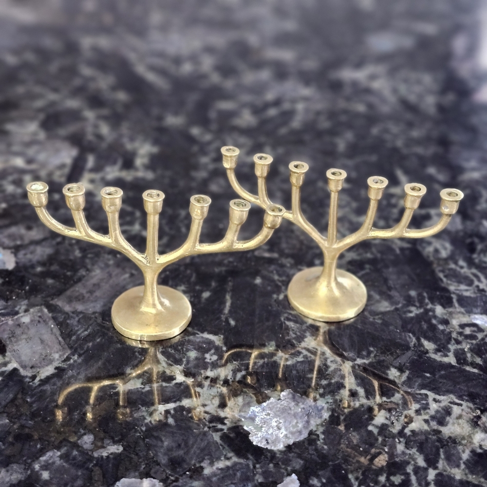 vintage Miniature brass menorahs, a significant symbol in Jewish tradition. 